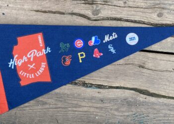 Photo of a blue pennant with logos of league and each majors team.